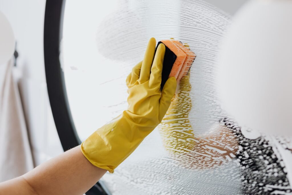 Friendly professional cleaner at work in a home